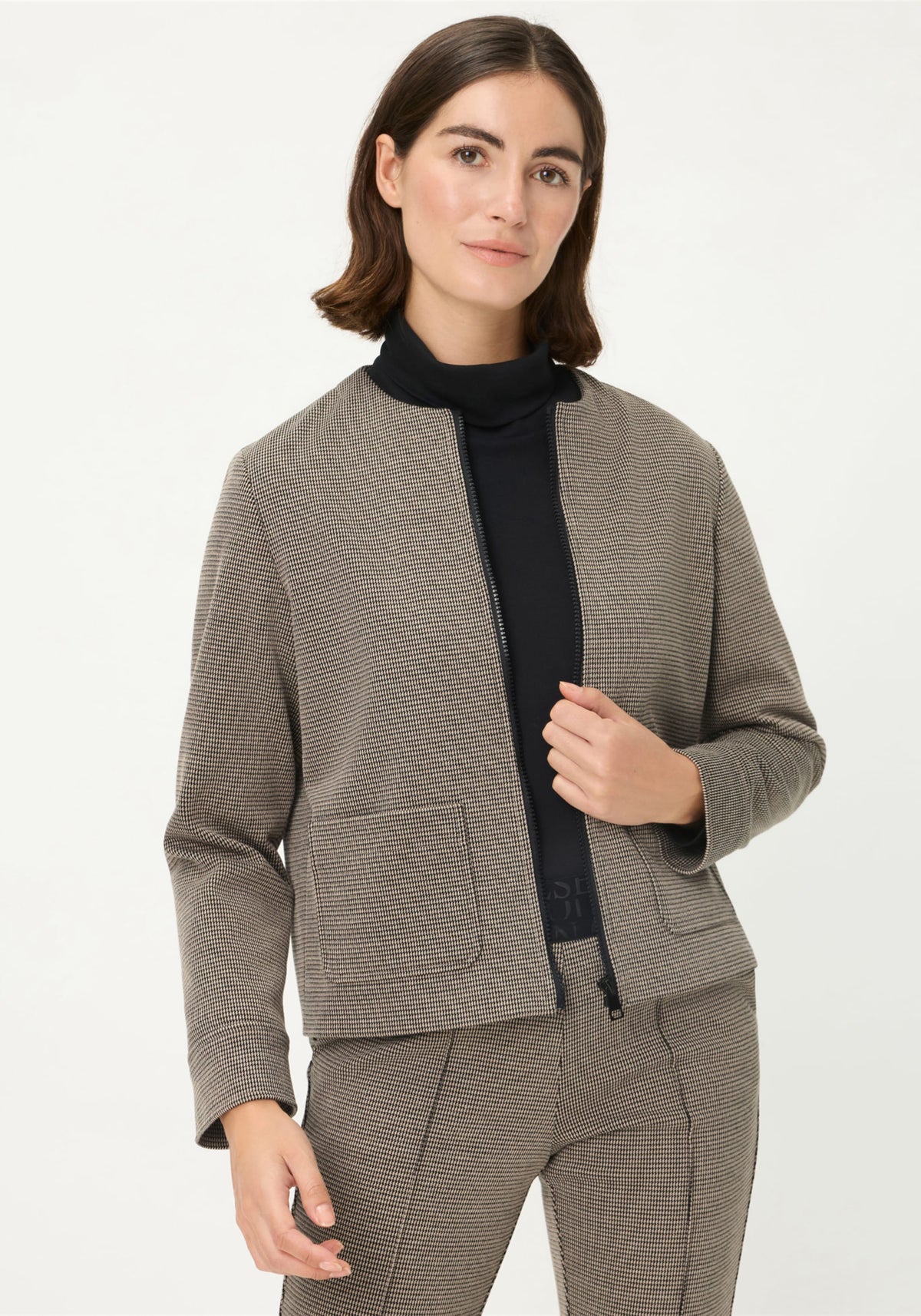 Veste à carreaux zippée